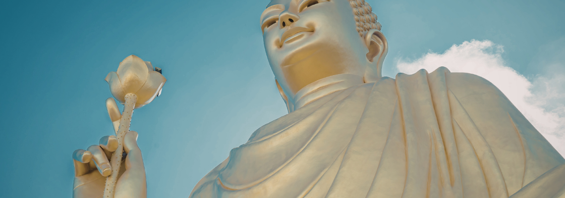 Buddha holds up a lotus