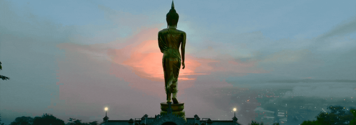 Buddha looks towards the sun setting in the West